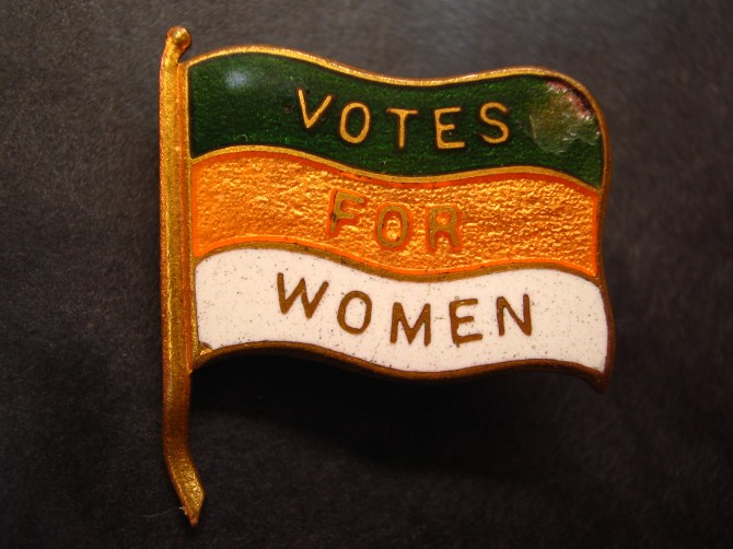 Photograph of an early 20th century British Women's Suffrage lapel pin, 