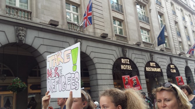 'Take More Refugees' sign at demonstration next to the Ritz Hotel. Photograph by Hannah Jones.